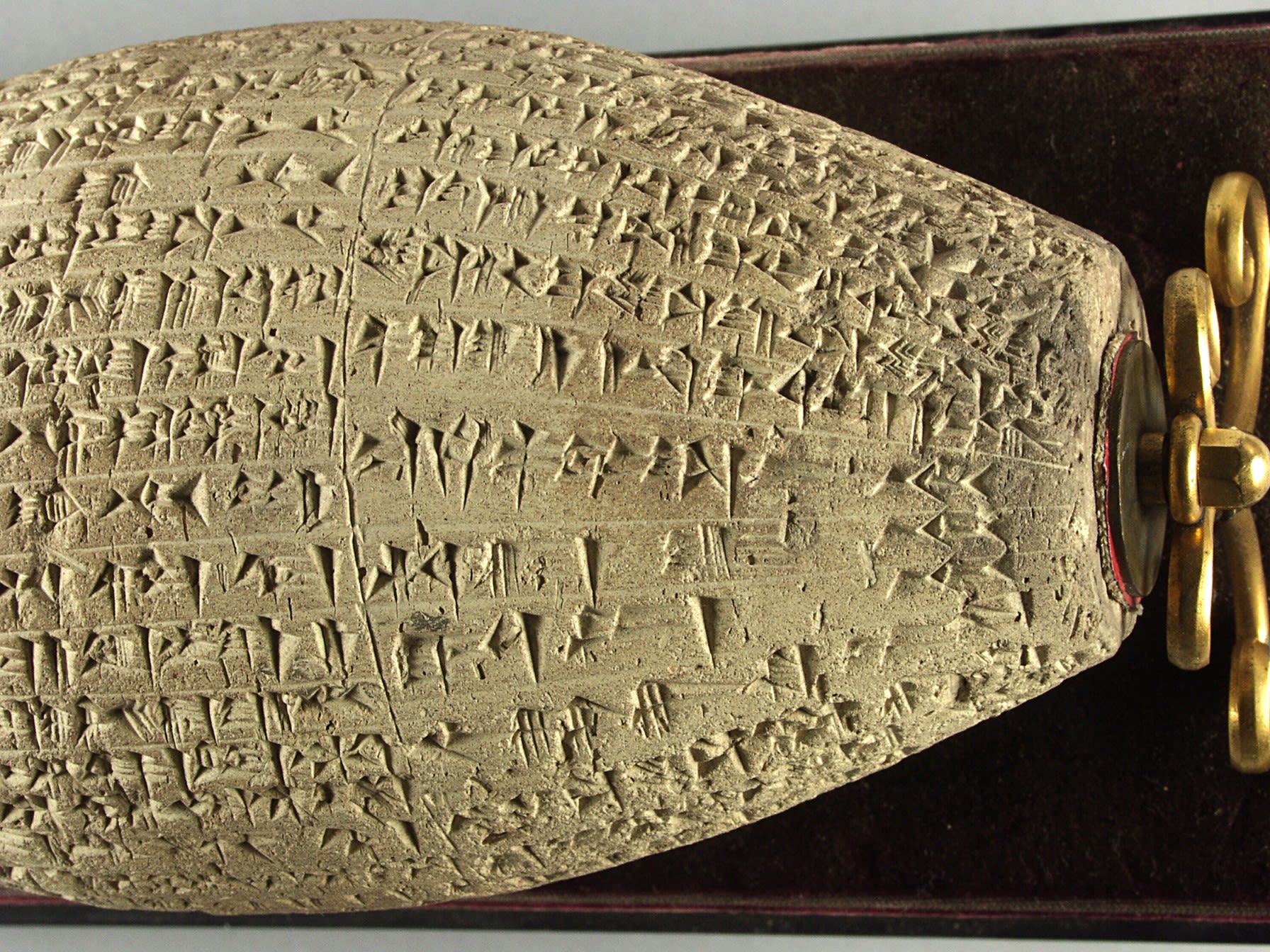 Close up of carvings on the right side of the cylinder in Kufic script