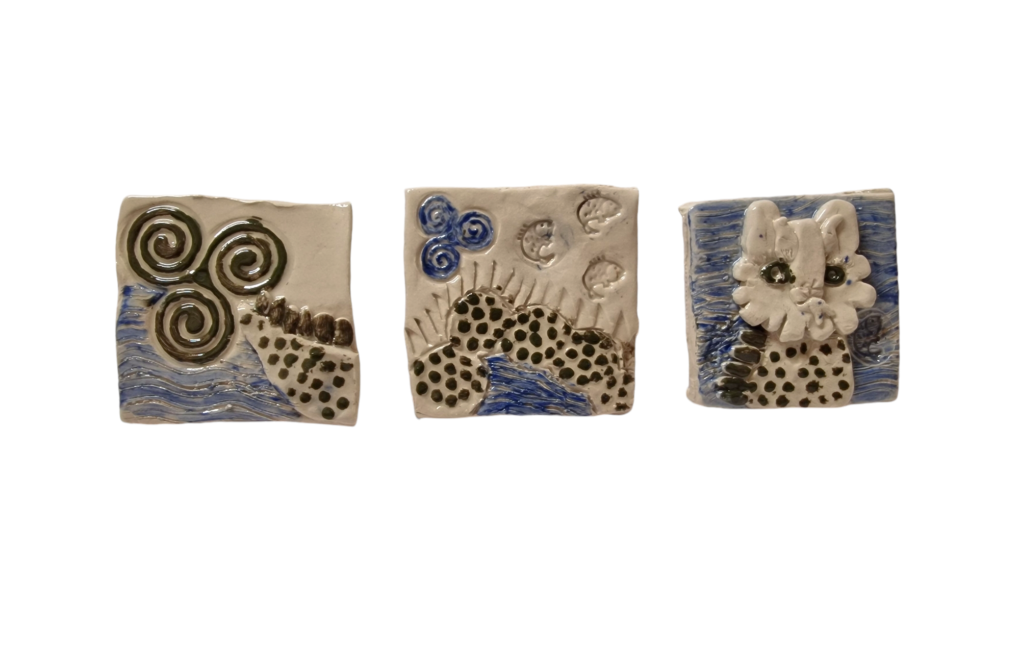 Three square tiles show tale, body and head of worm like creature. 