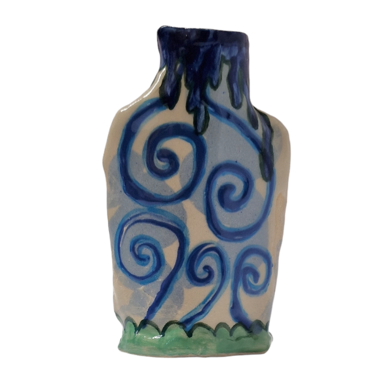 Hand built bottle with dark blue painted drips around the mouth and swirl patterns on the body. On the base is a green wave pattern.