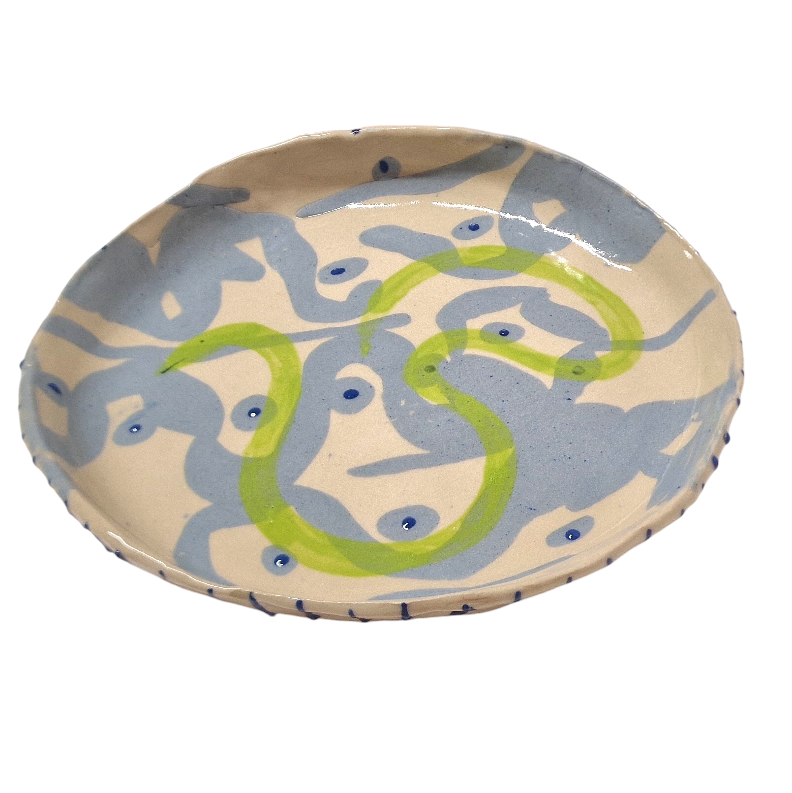 Hump built plate with blue pattern and green worm like creature painted in the middle