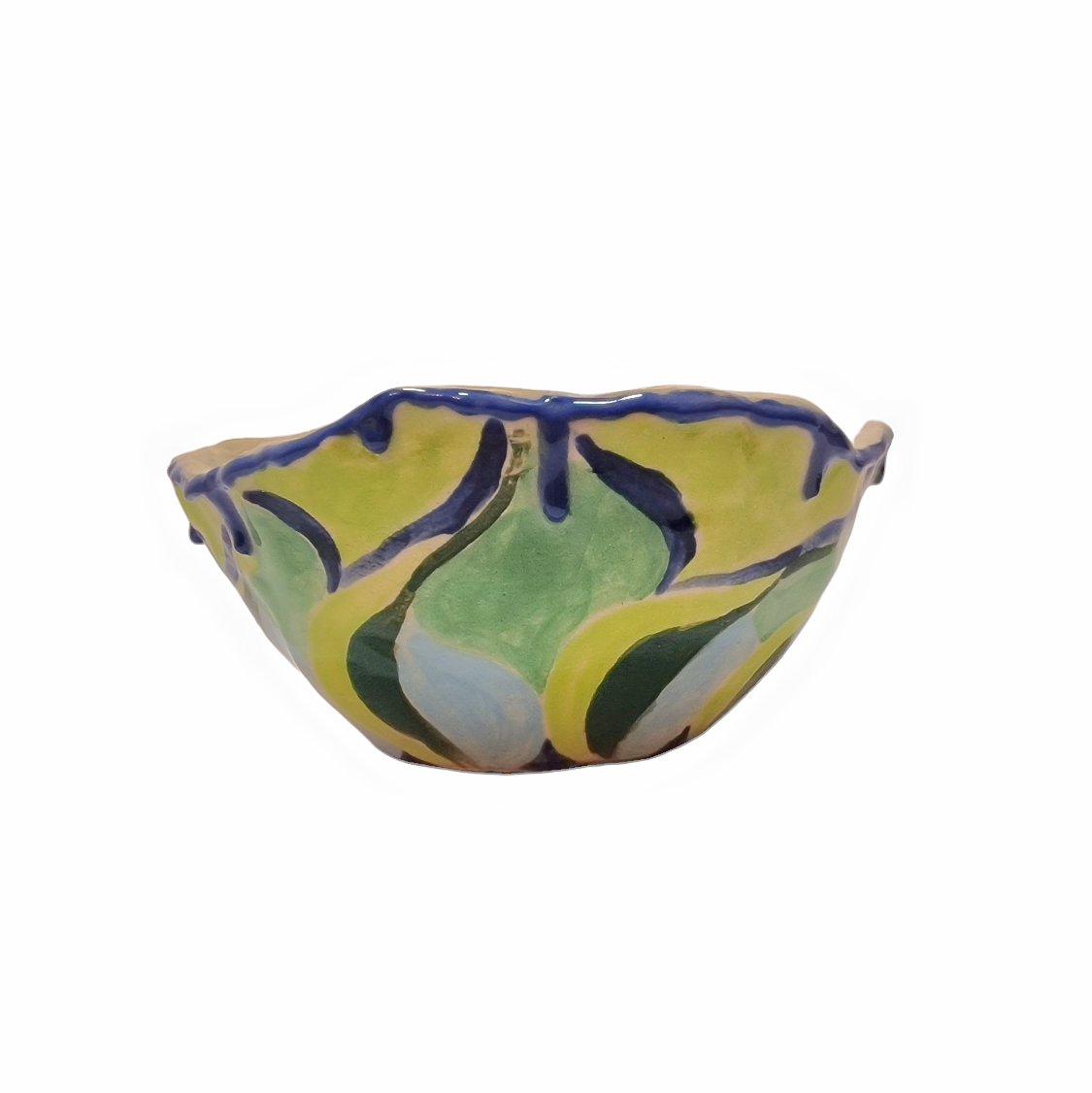 Side view of hump made stoneware bowl with abstract shapes in greens and blues