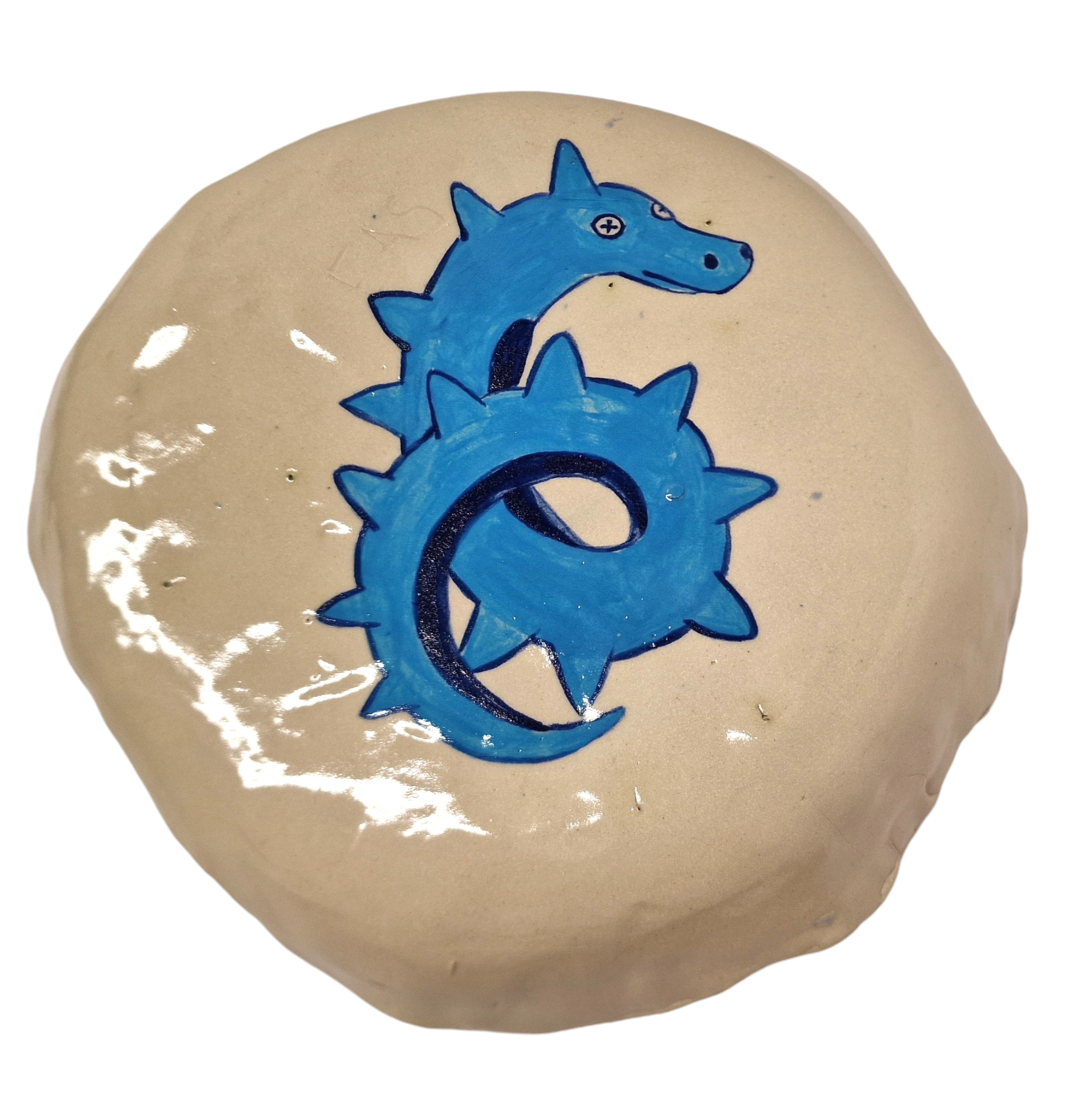 Hump built plate with dragon like blue creature hand painted on base of plate