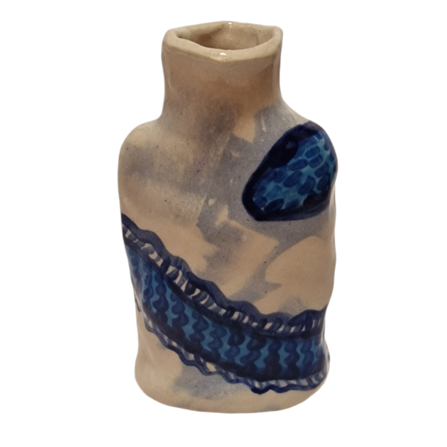 Blue bottle with worm like creature