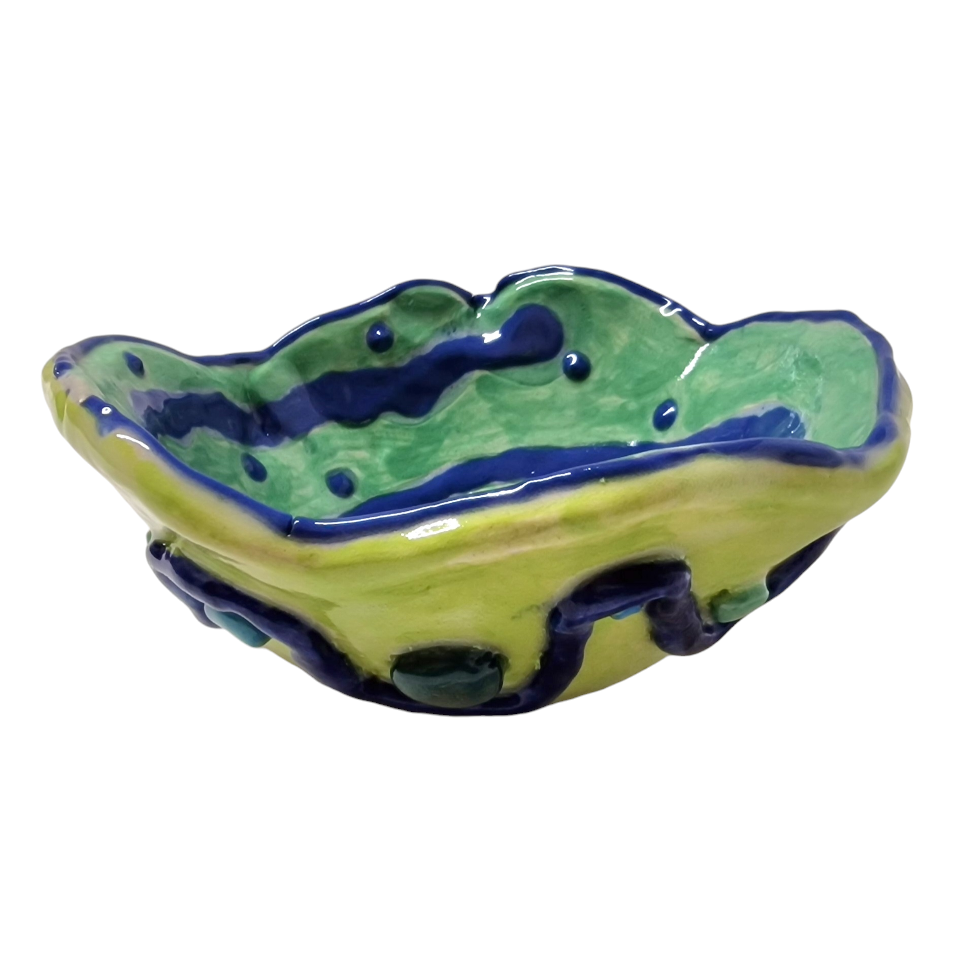 Hand built bowl with green background and abstract patterns