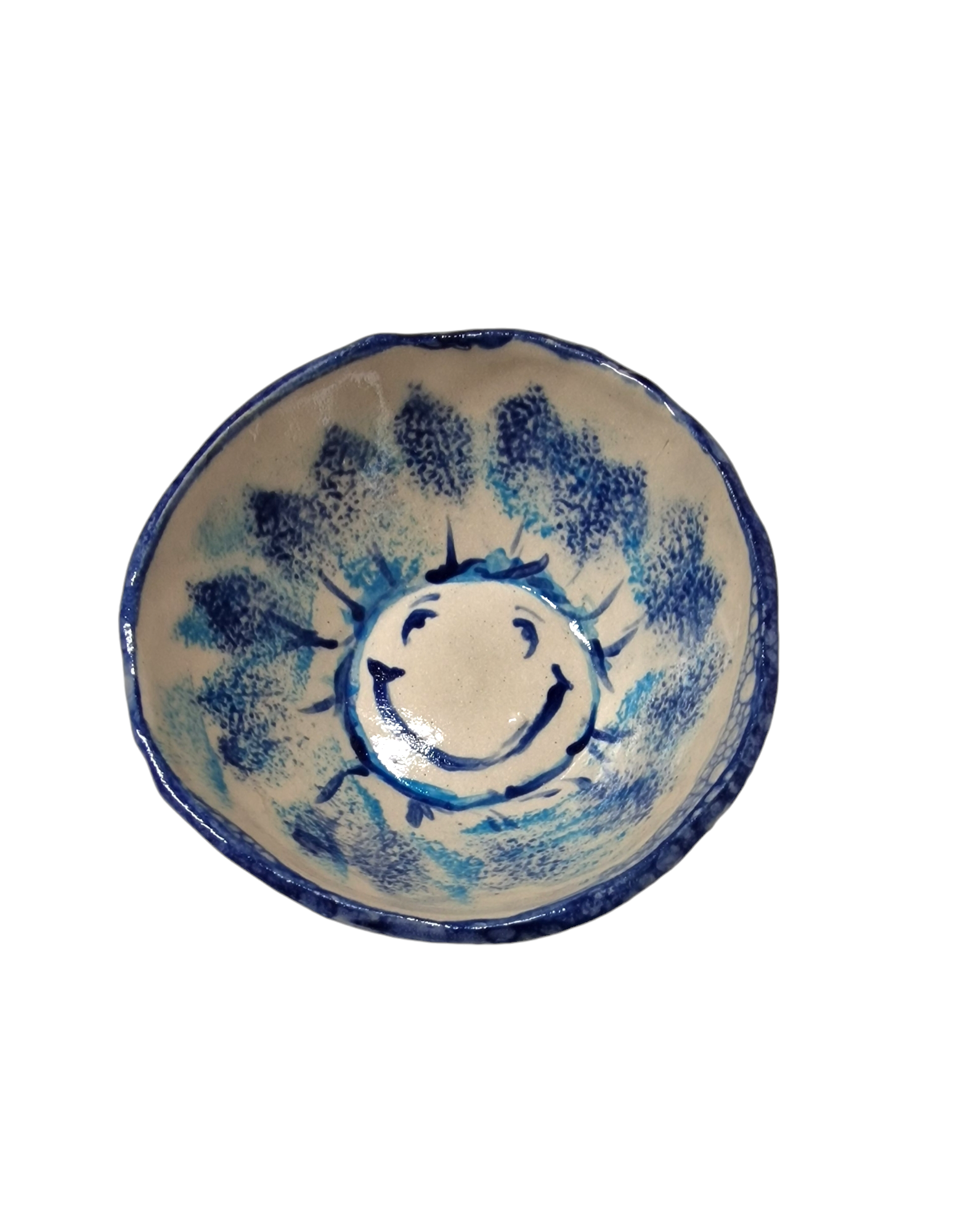 Above view of hump made stoneware bowl with blue smiley face in the center