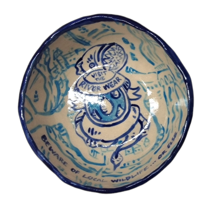 Above view of hump made stoneware bowl with worm like creature with the text: Visit the River Wear