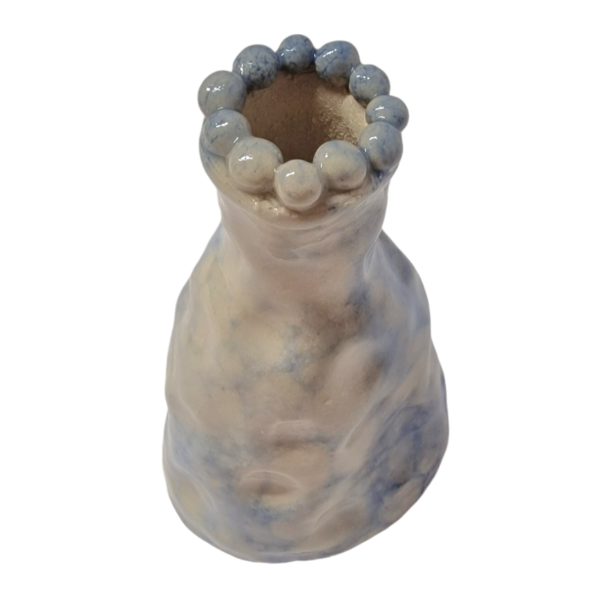 Hand built bottle with 3D beading along the mouth of the bottle. A light blue bubbling pattern is all over the bottle