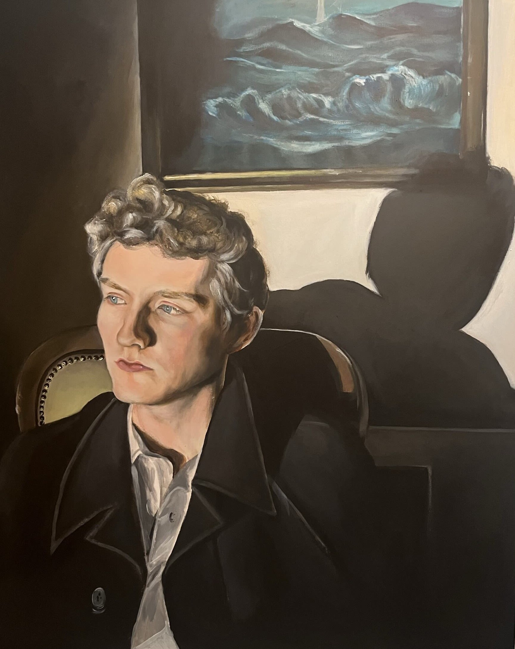 Painting of person sitting in chair looking off to the left of the frame. Behind them you see their shadow on the wall and framed painting. 