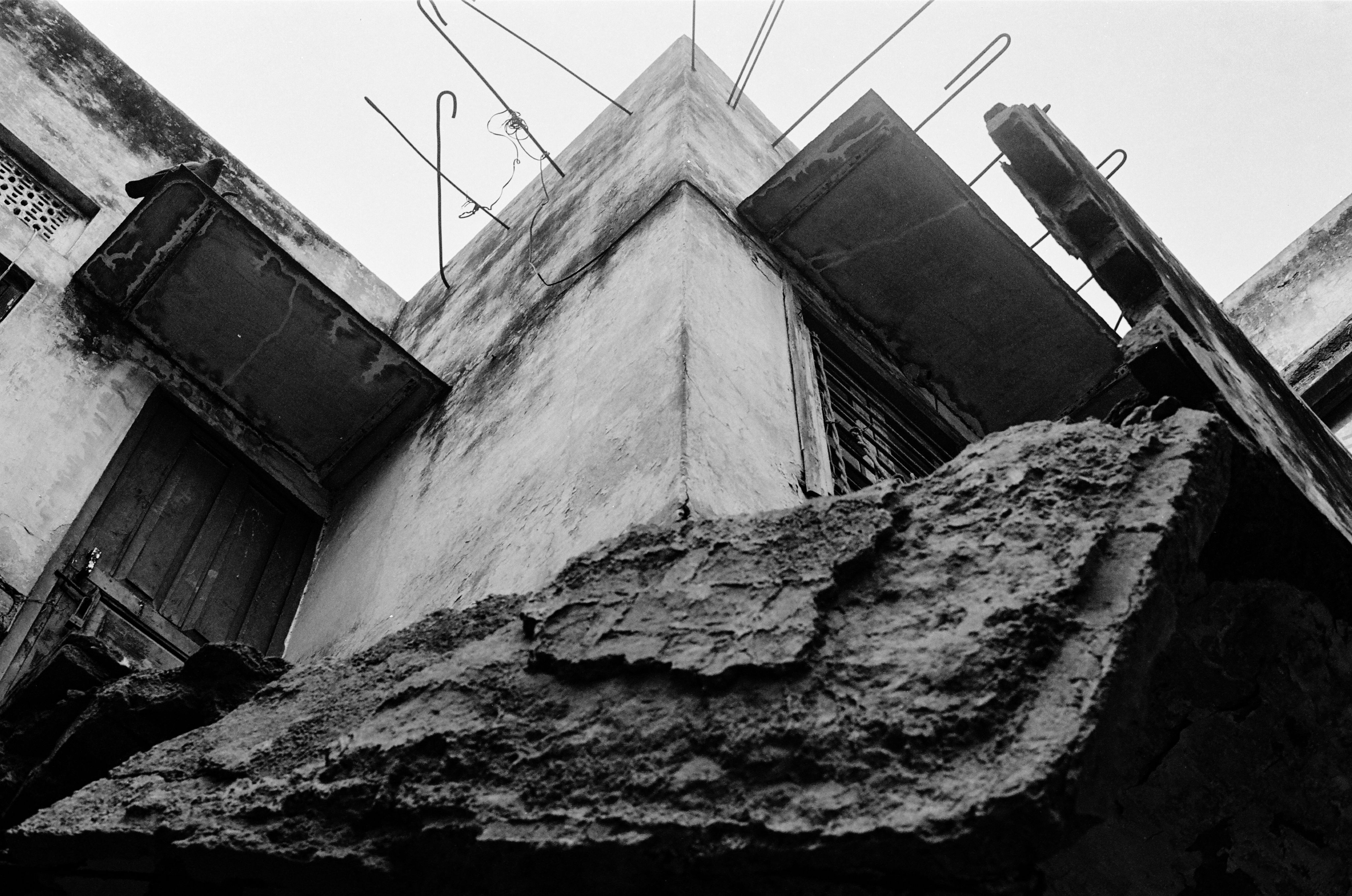 Black and white photo of a building under constructed   