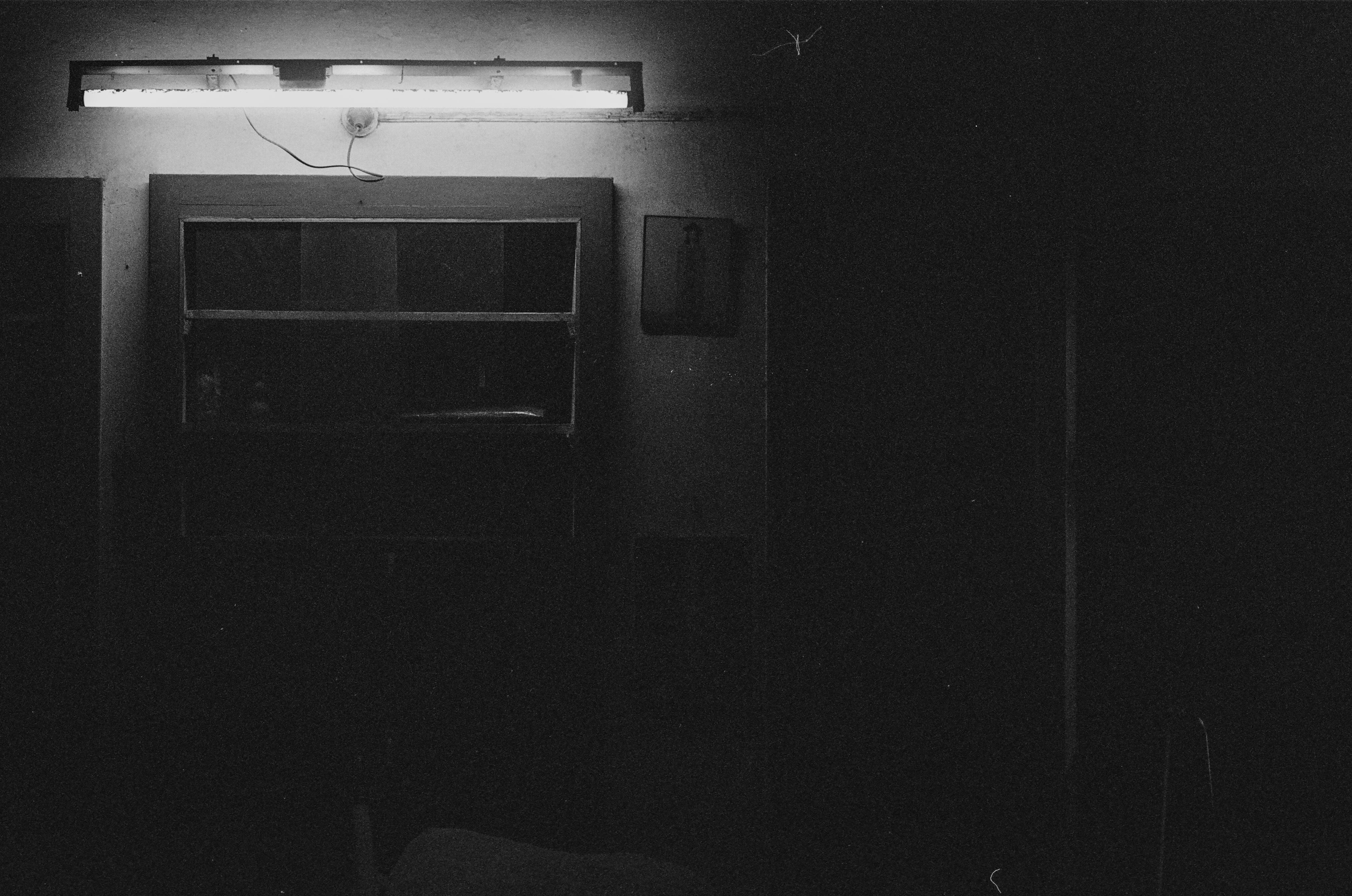 Black and white photo of a dark room