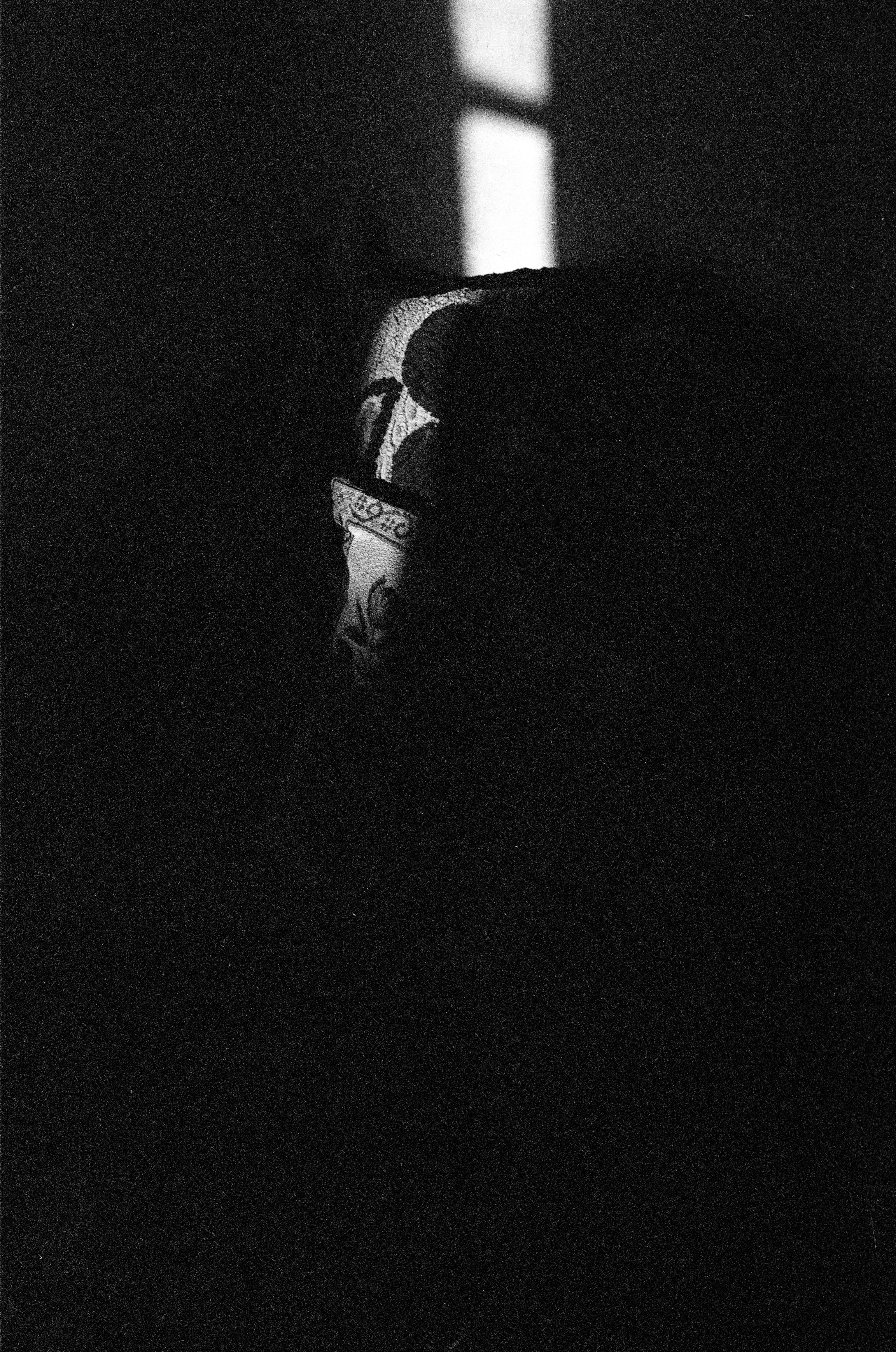 Black and white photo showing dark room