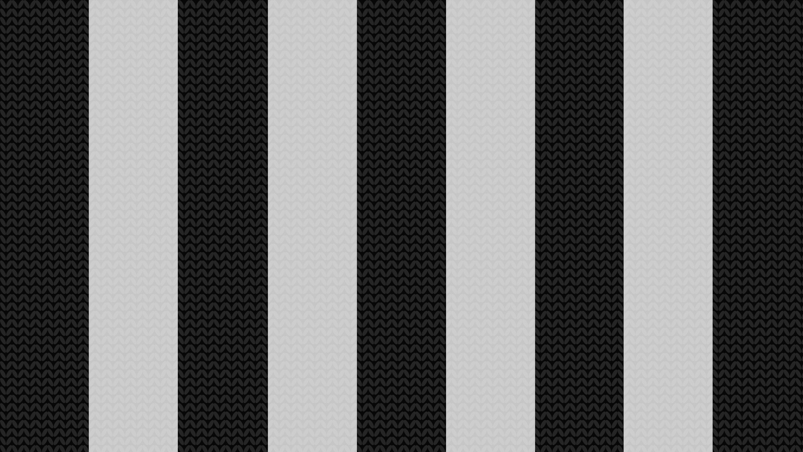 Background image of a black and white football scarf, representing Newcastle United.