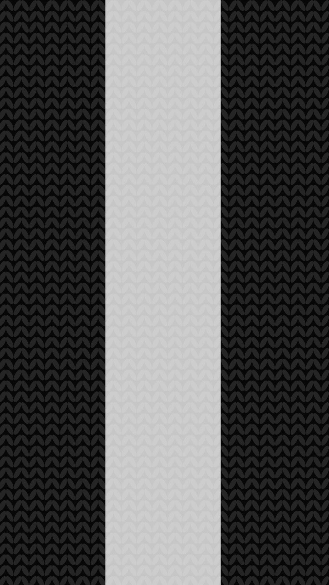 Background image of a black and white football scarf, representing Newcastle United.