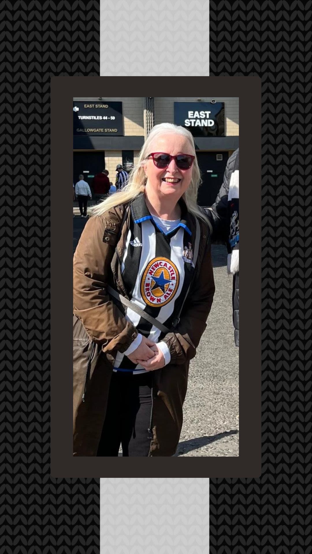 Photo of Sue in her Newcastle shirt stood outside St James' Park.