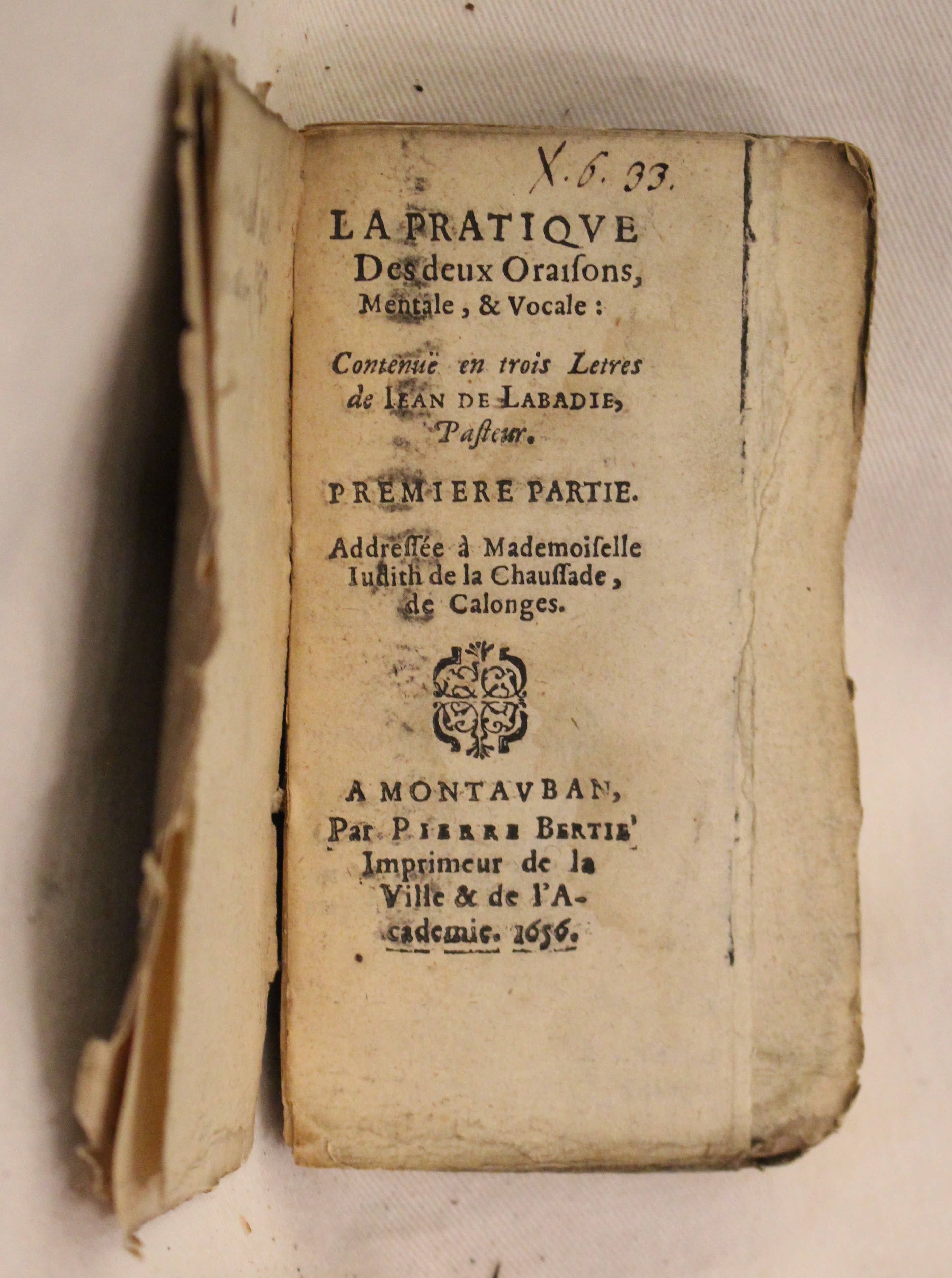 Rare treatise on prayer by a Jesuit turned Calvinist in a 17th-century paper wrapper, leaves unopened.