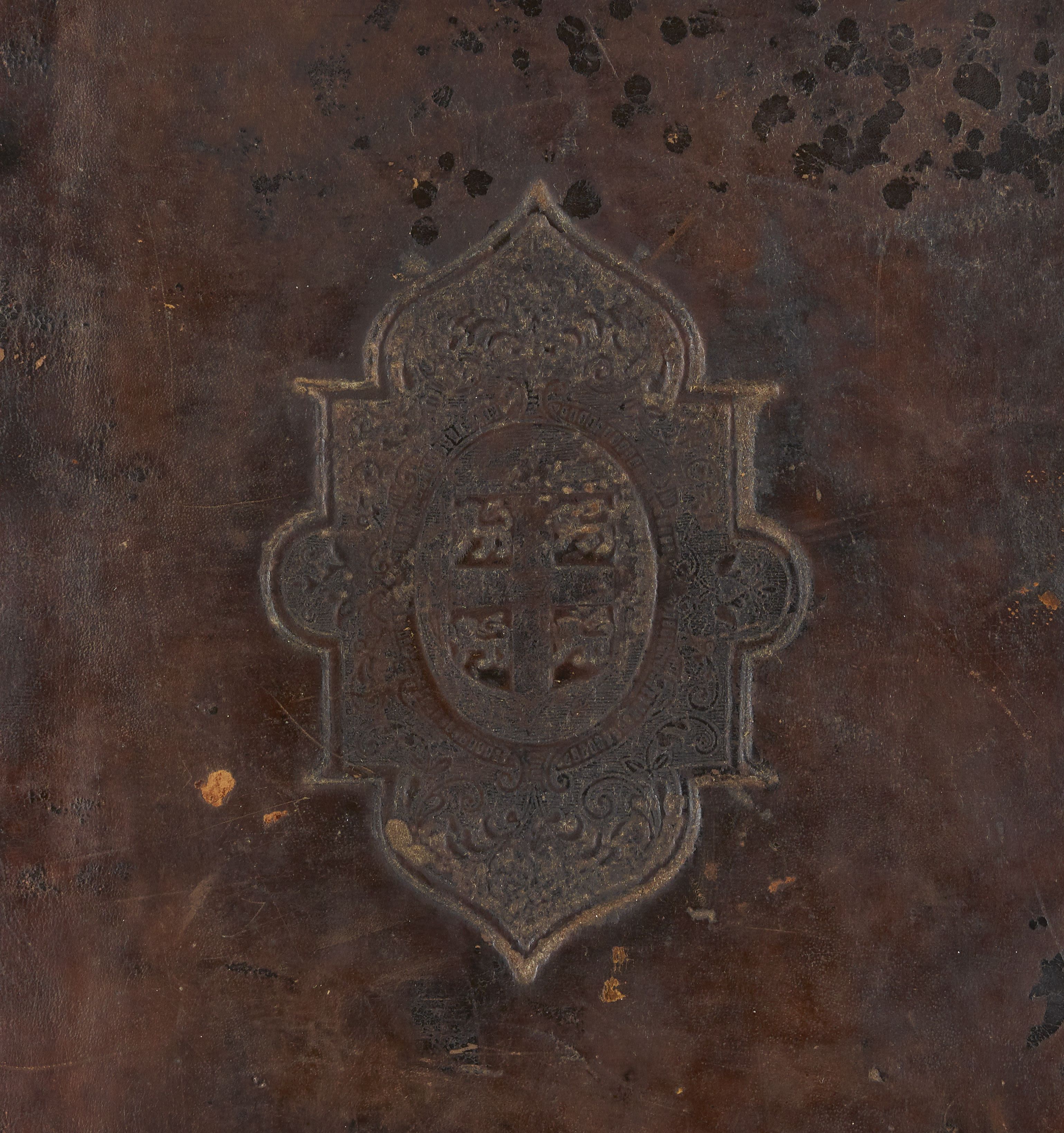 Blind-tooled arabesque centre piece on the front cover of DUL Cosin B.1.9/1
