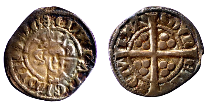 Photo showing two sides of a coin. Some text is visible, as well as a cross shape