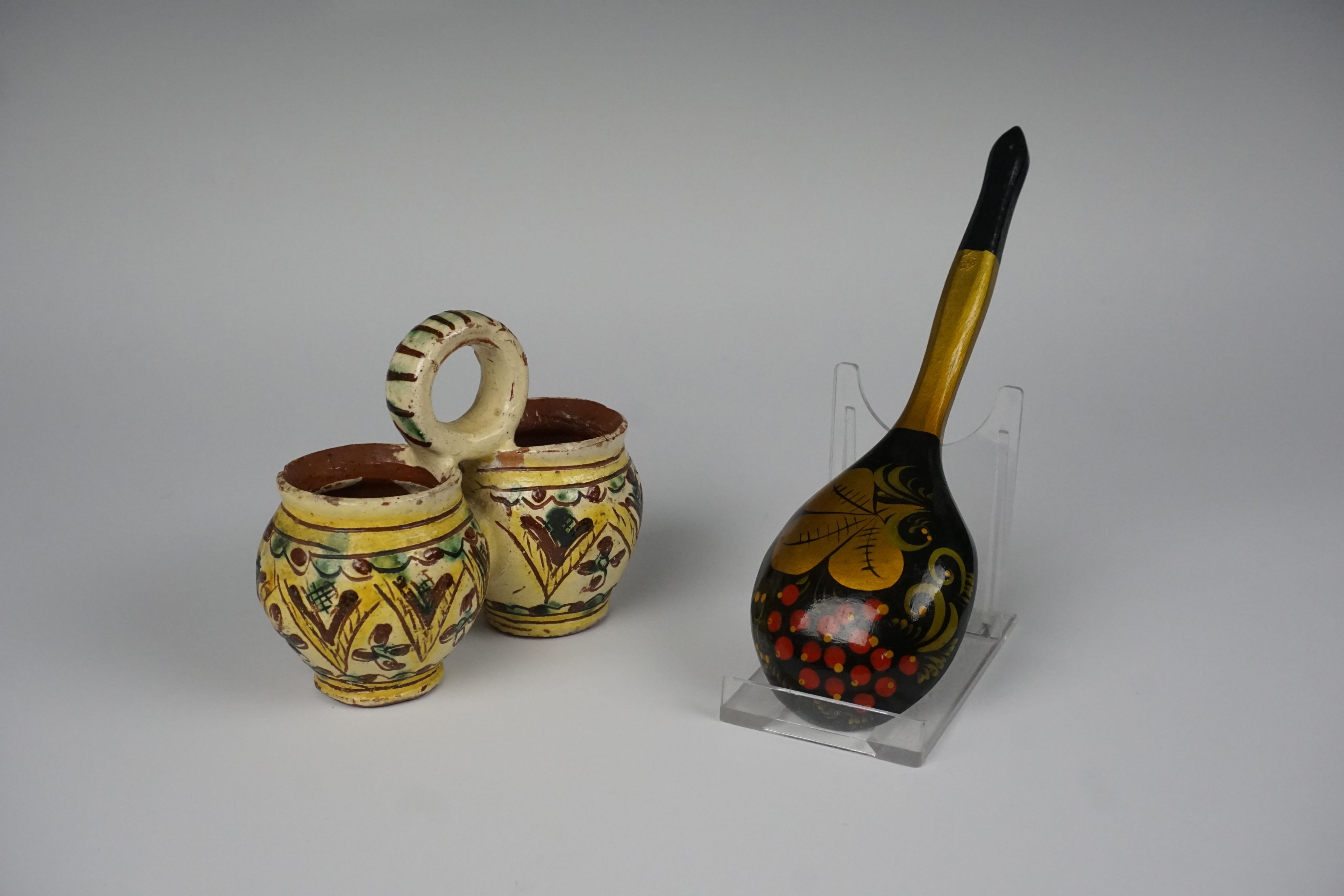 ceramic dish with two small globular jars and a decorated spoon