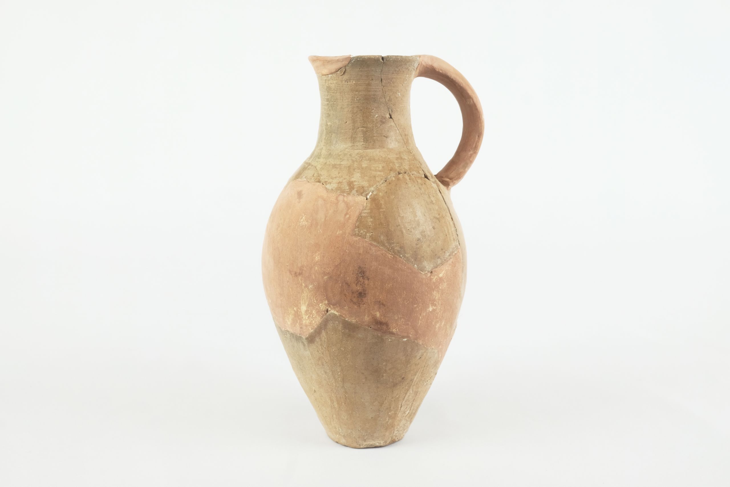 Tall jar reconstructed with tan plaster on the handle, rim, and body