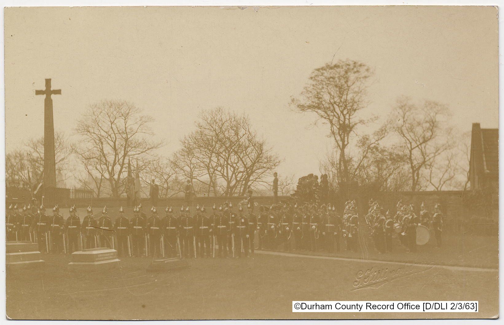 DLI soldiers line up with a band outside Durham Cathedral in this sepia tinted photograph.