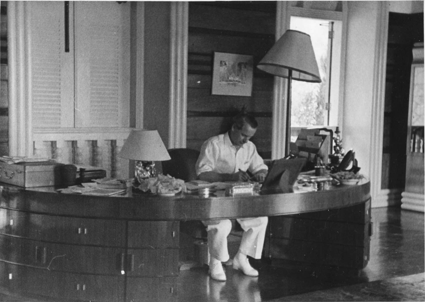 Malcolm MacDonald sat at his desk in his office in Singapore writing notes